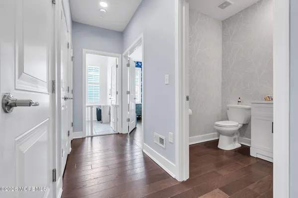 a living room with fireplace furniture and a large window