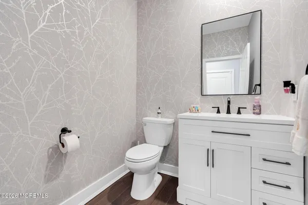 a view of a dining area with furniture and wooden floor