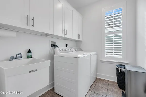 a large room with furniture and wooden floor