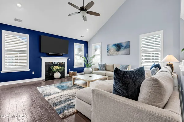a living room with furniture or couch and a potted plant