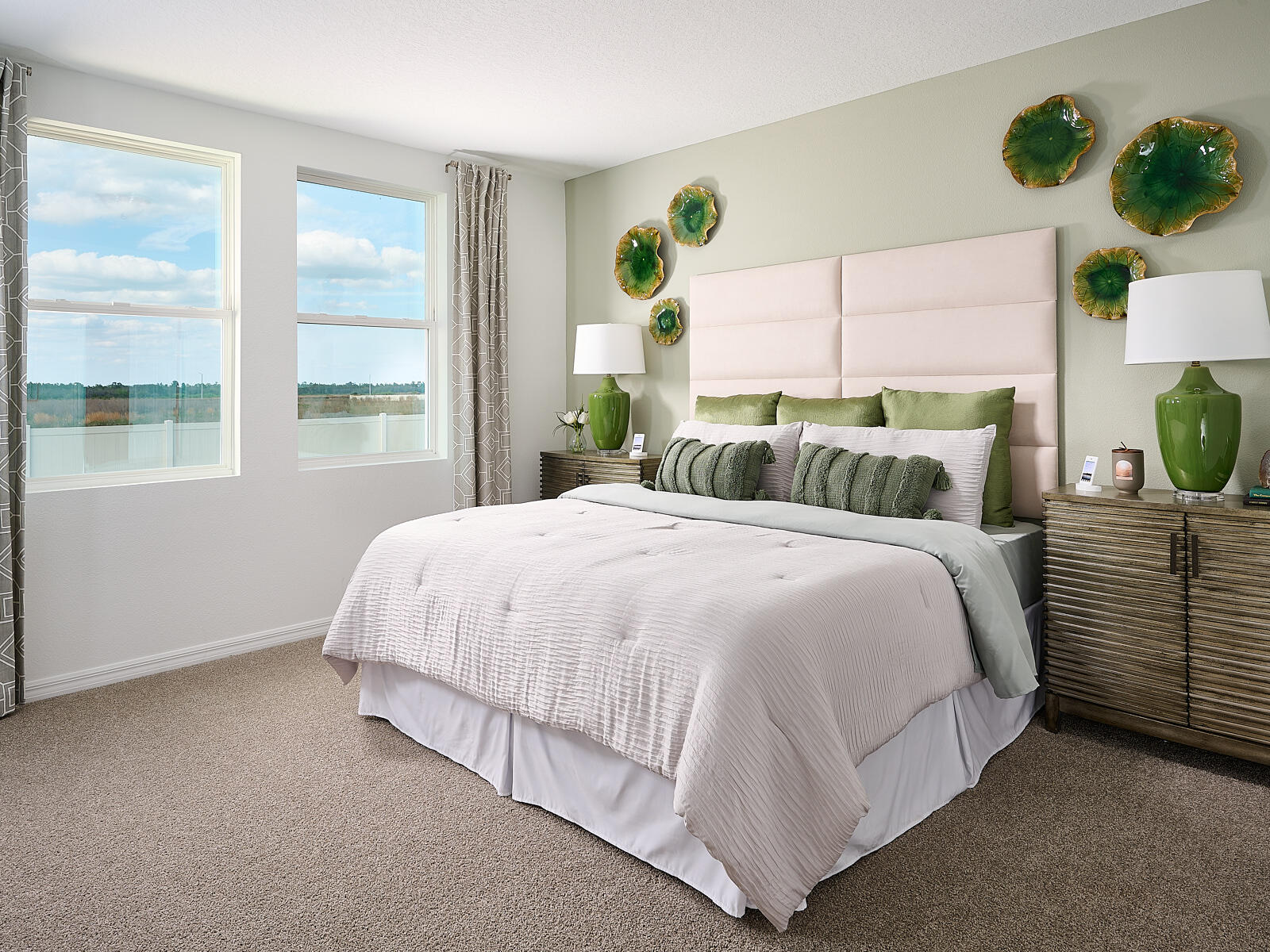 14418 Southwest New Dawn Road Indiantown, FL 34956 - Photo 7 of 16 a bed sitting in a bedroom next to a window