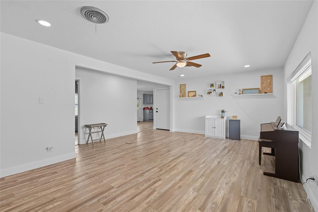 421 East Tarrant Road Grand Prairie, TX 75050 - Photo 11 of 32 Unfurnished living room with recessed lighting, light wood-style floors, and ceiling fan