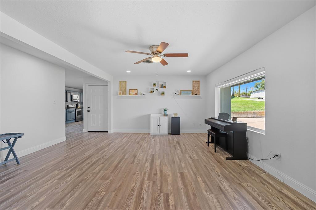 421 East Tarrant Road Grand Prairie, TX 75050 - Photo 12 of 32 Living area with light wood-style flooring, a ceiling fan, and recessed lighting