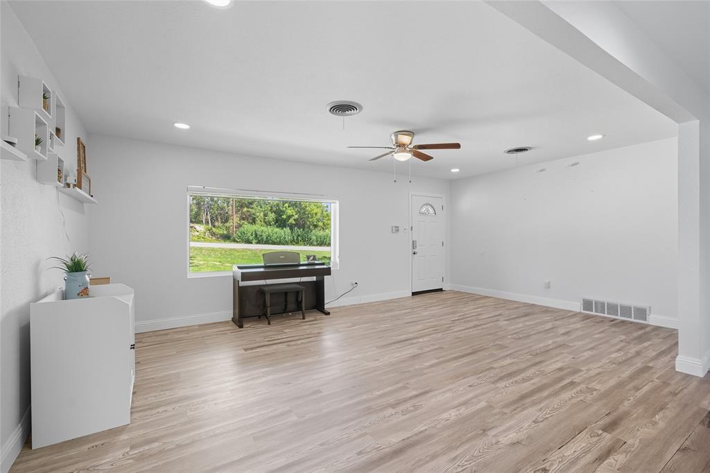 421 East Tarrant Road Grand Prairie, TX 75050 - Photo 13 of 32 Living room with light wood-type flooring, recessed lighting, and a ceiling fan