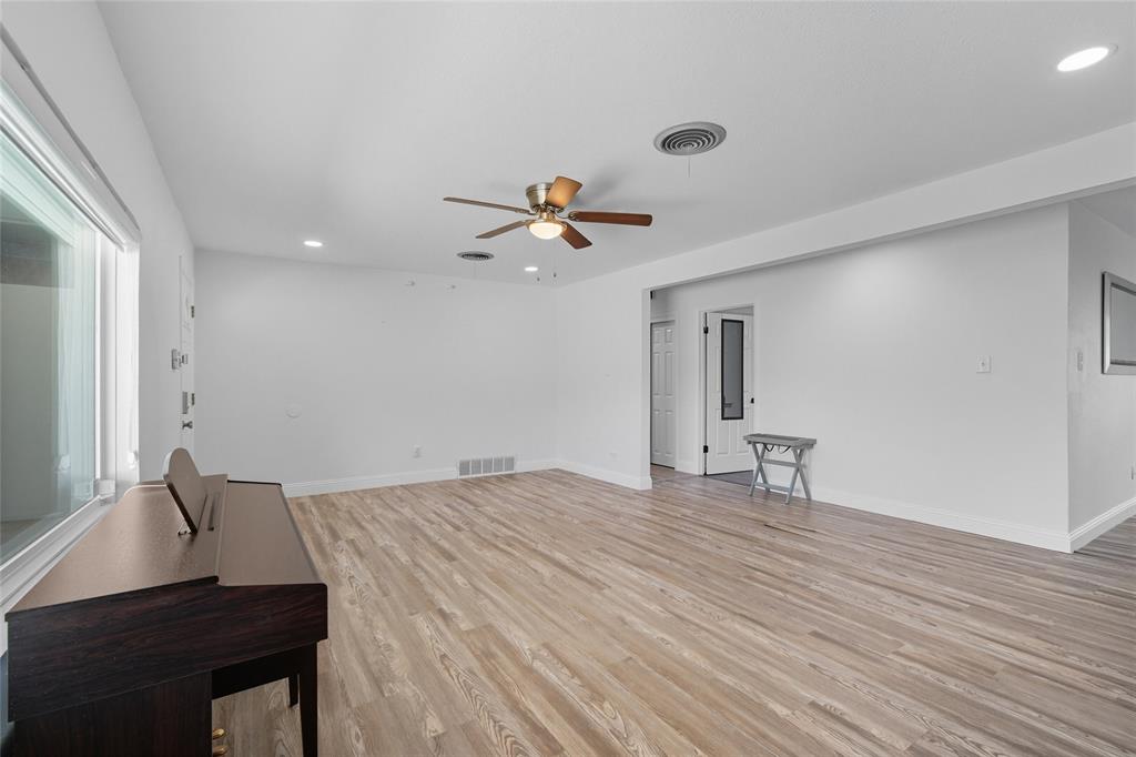 421 East Tarrant Road Grand Prairie, TX 75050 - Photo 15 of 32 Unfurnished living room with recessed lighting, light wood finished floors, and ceiling fan
