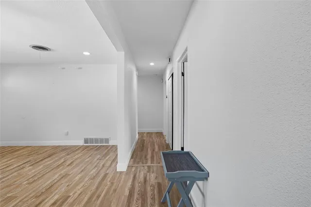 a view of room with wooden floor and chair