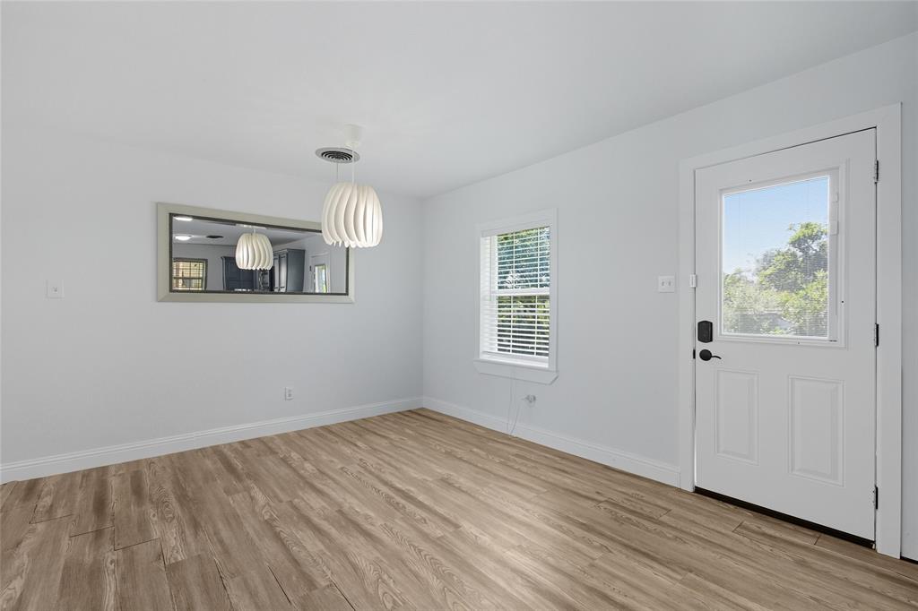 421 East Tarrant Road Grand Prairie, TX 75050 - Photo 22 of 32 Unfurnished dining area with light wood-style floors and baseboards