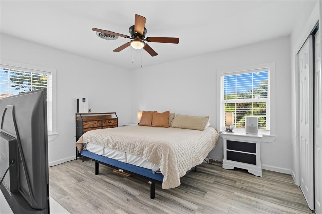 421 East Tarrant Road Grand Prairie, TX 75050 - Photo 25 of 32 Bedroom with a closet, light wood-type flooring, and ceiling fan