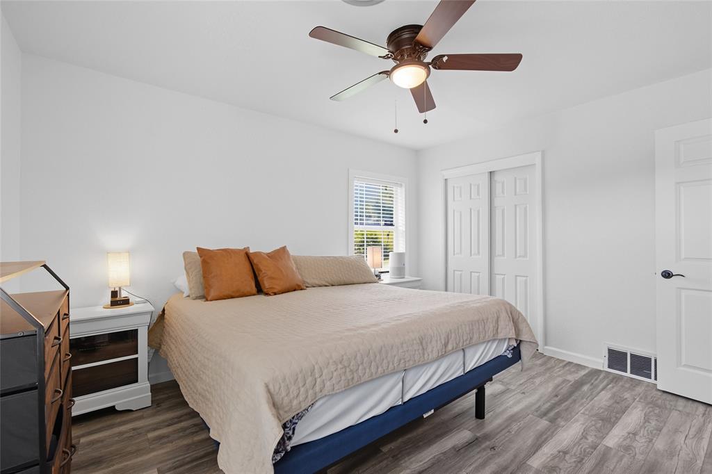 421 East Tarrant Road Grand Prairie, TX 75050 - Photo 26 of 32 Bedroom with wood finished floors, a closet, and a ceiling fan