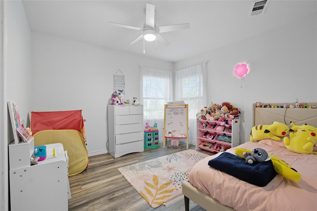 421 East Tarrant Road Grand Prairie, TX 75050 - Photo 29 of 32 Bedroom with wood finished floors and ceiling fan