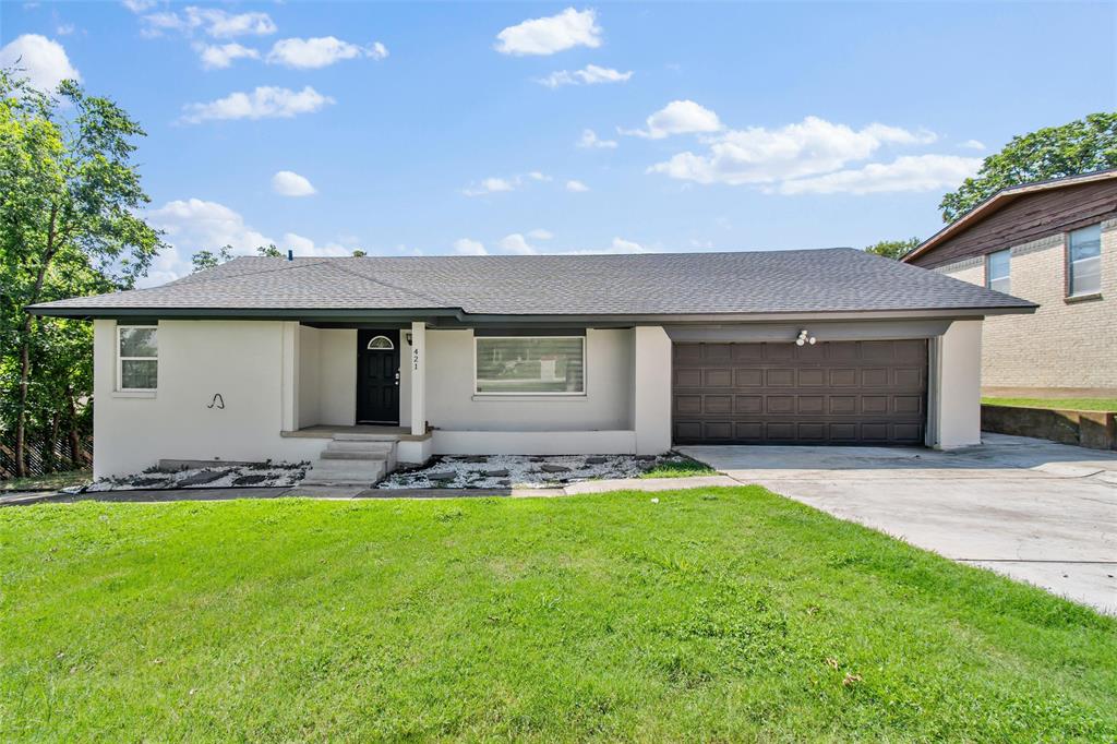 421 East Tarrant Road Grand Prairie, TX 75050 - Photo 3 of 32 View of front of house featuring a shingled roof, concrete driveway, a front yard, and stucco siding