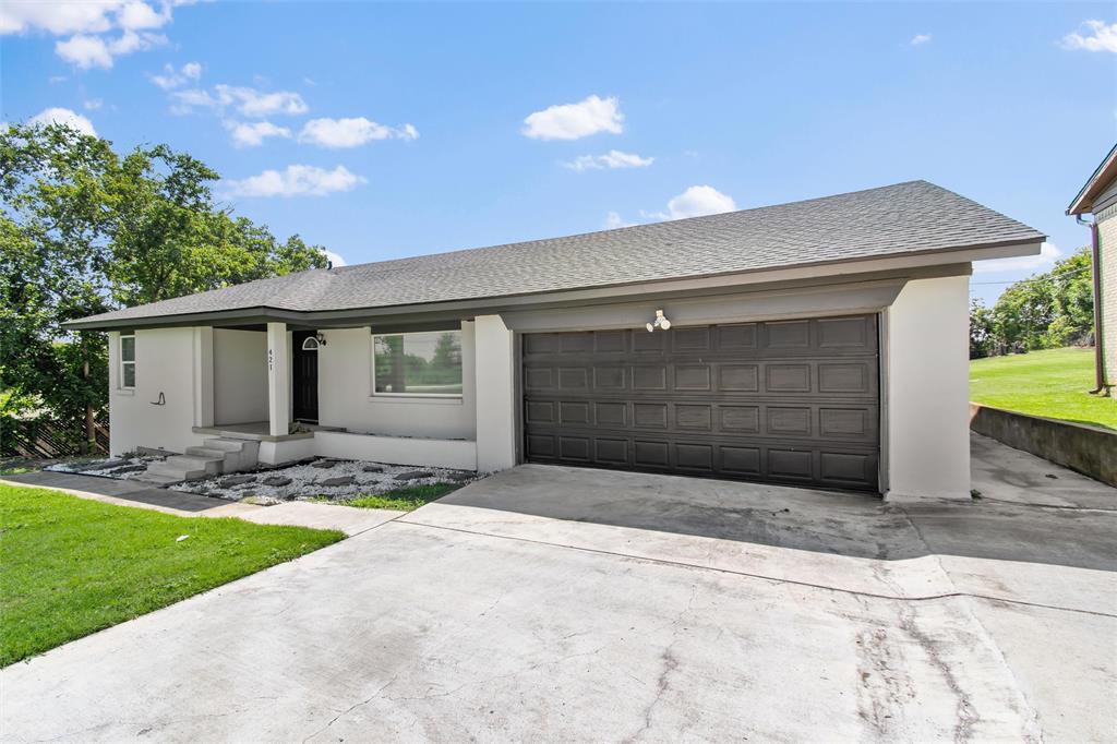 421 East Tarrant Road Grand Prairie, TX 75050 - Photo 6 of 32 Ranch-style home featuring a front lawn, concrete driveway, roof with shingles, and stucco siding