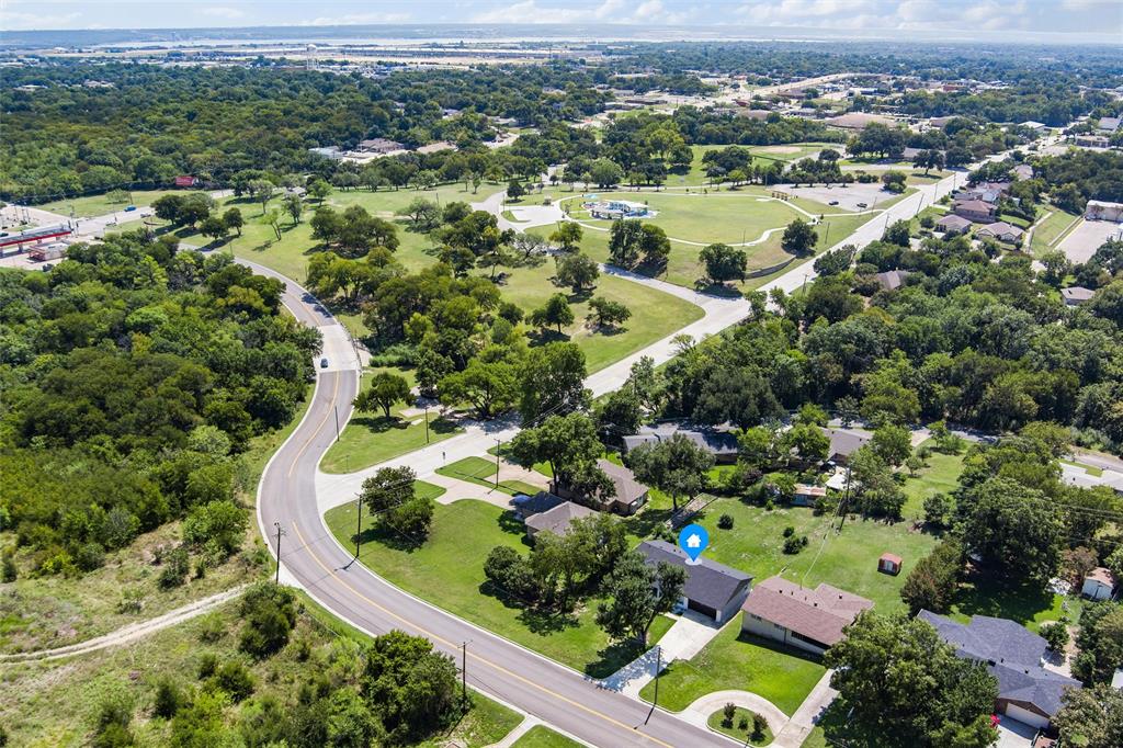 421 East Tarrant Road Grand Prairie, TX 75050 - Photo 8 of 32 Aerial view of residential area with a tree filled landscape