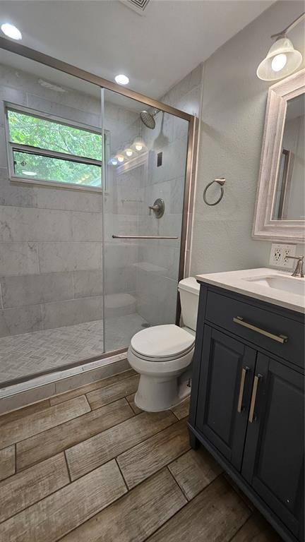 6412 Pawling Avenue Port Richey, FL 34668 - Photo 15 of 24 a bathroom with a sink toilet and shower