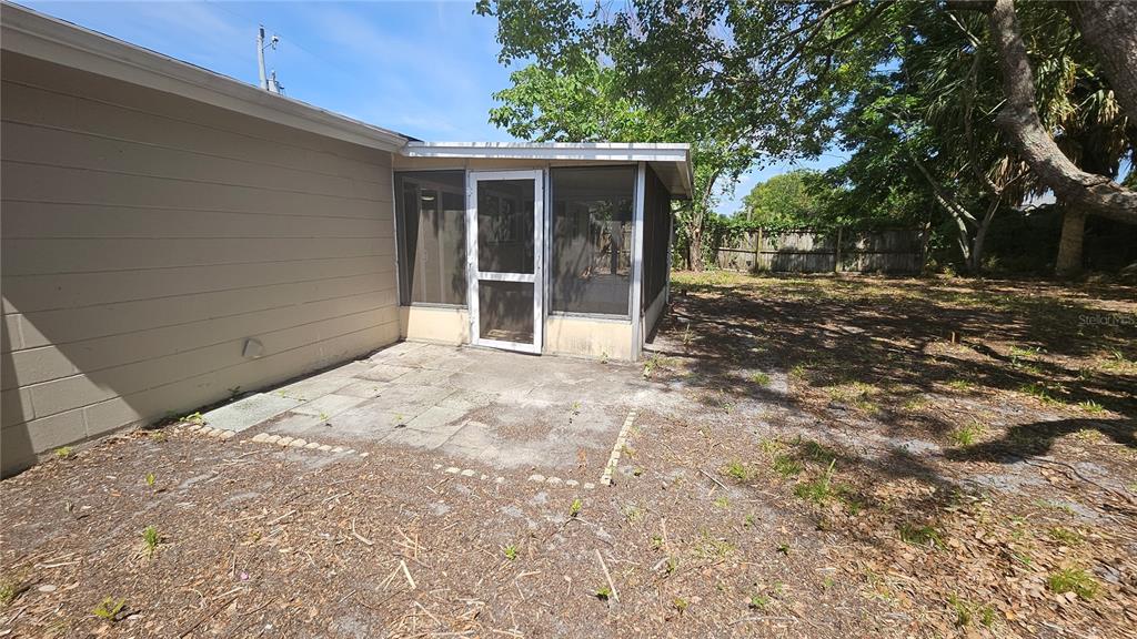 6412 Pawling Avenue Port Richey, FL 34668 - Photo 22 of 24 a view of a house with a yard and tree