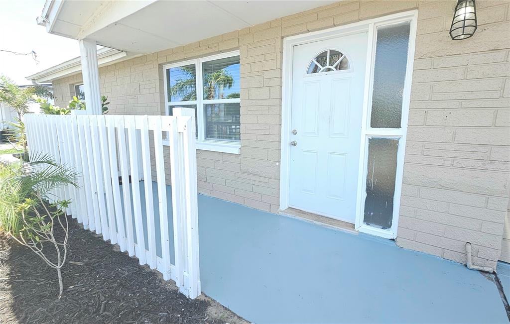 6412 Pawling Avenue Port Richey, FL 34668 - Photo 24 of 24 a view of a wooden door front of a house