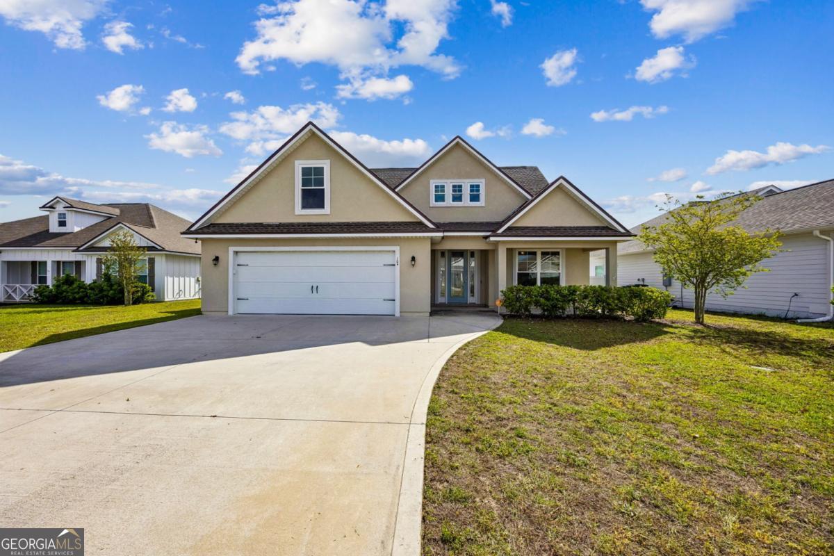 a front view of a house with yard