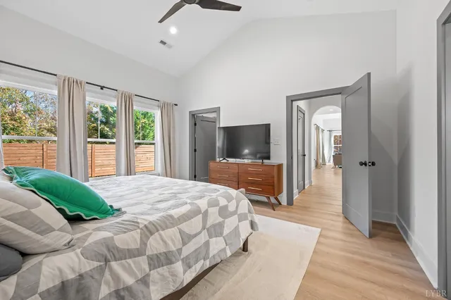 a bathroom with a granite countertop sink and a toilet