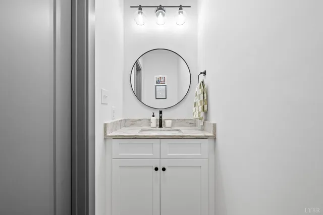 a living room with furniture and a clock