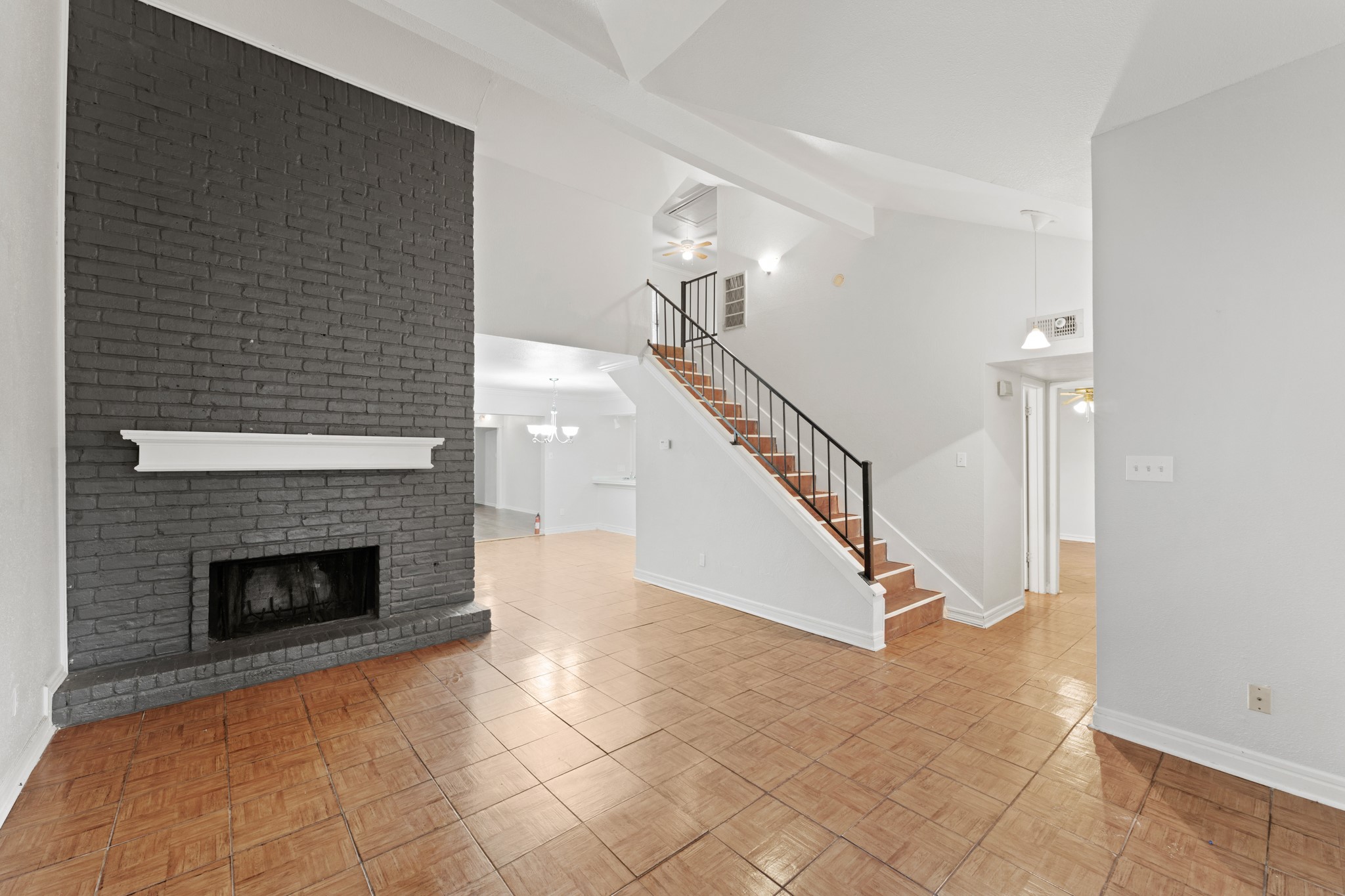 5715 Easthampton Drive, Unit A Houston, TX 77039 - Photo 1 of 6 a view of a livingroom with stairs and a fireplace
