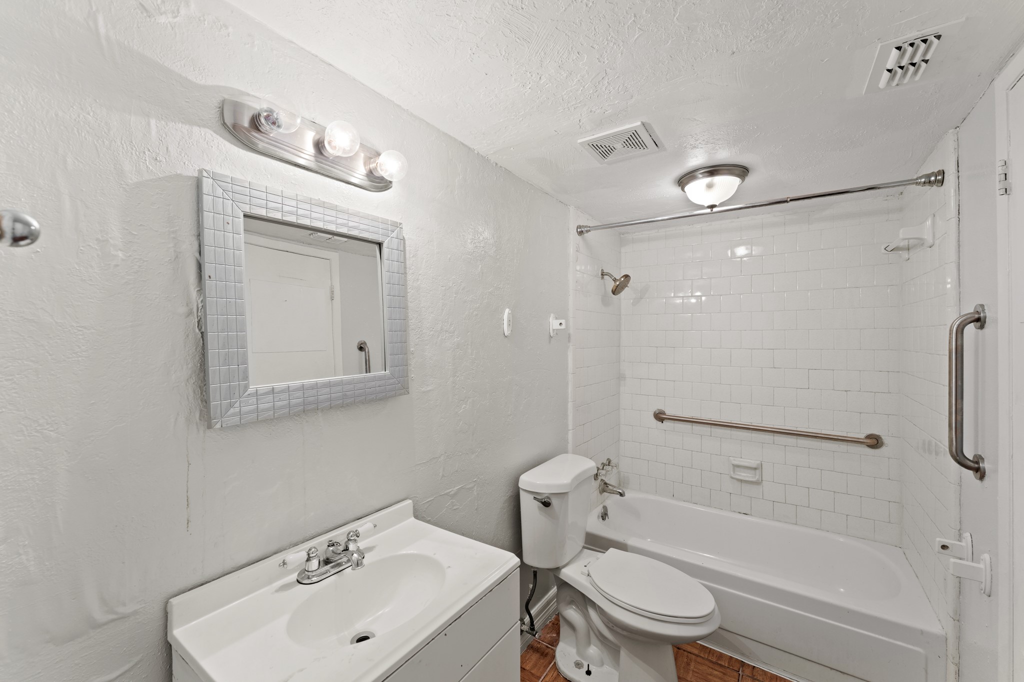 5715 Easthampton Drive, Unit A Houston, TX 77039 - Photo 3 of 6 a bathroom with a sink toilet and shower