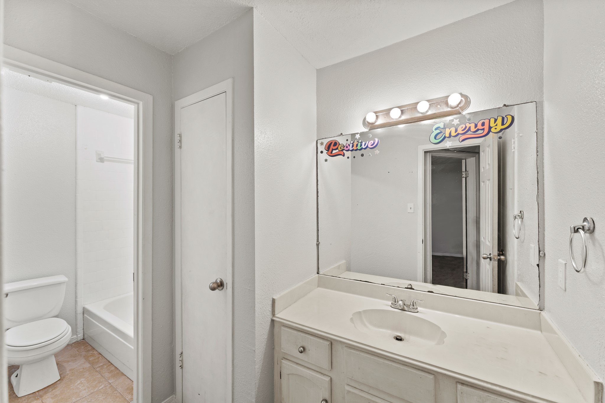 5715 Easthampton Drive, Unit A Houston, TX 77039 - Photo 5 of 6 a bathroom with a sink a toilet and a mirror