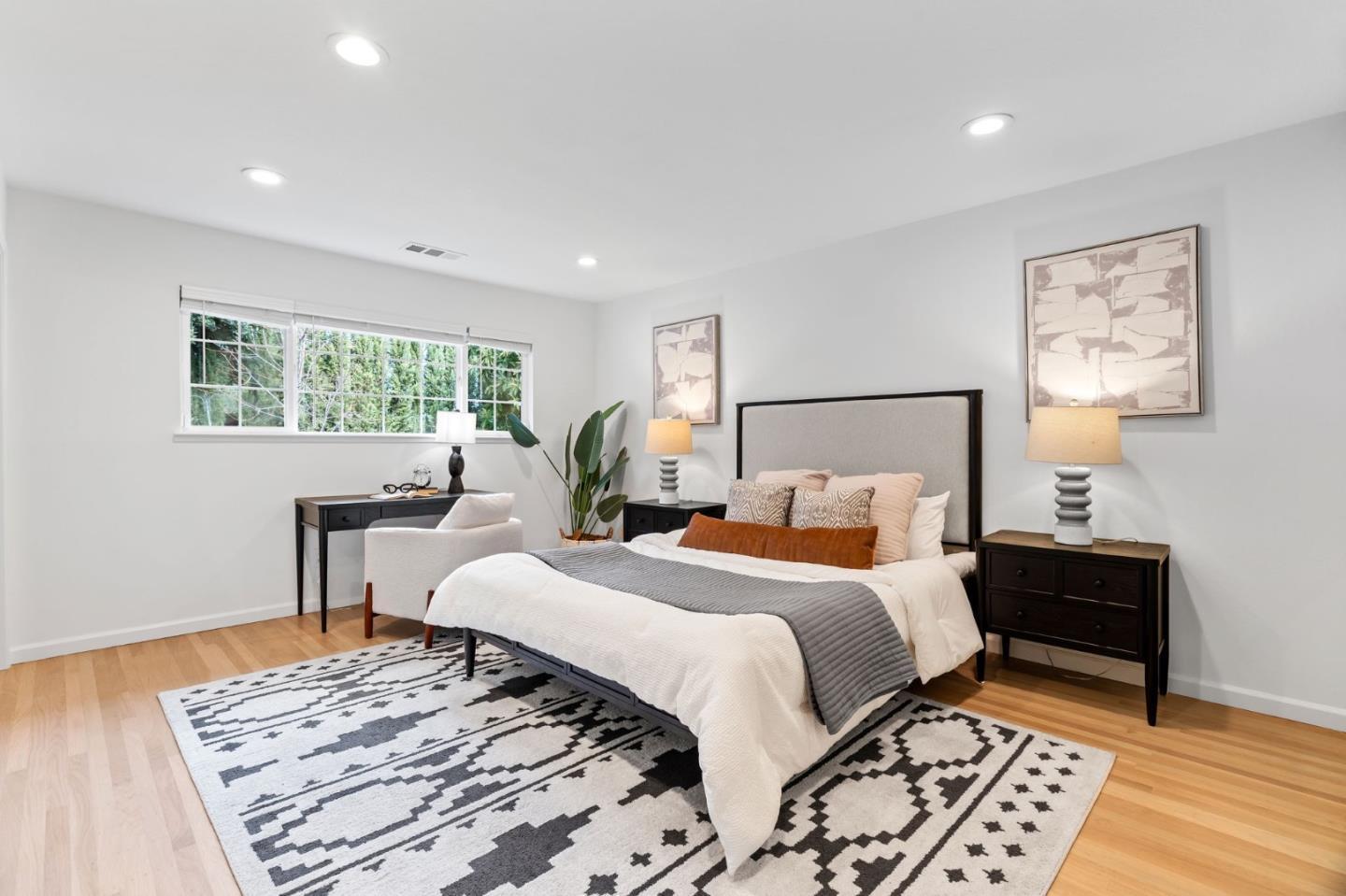 1002 Oaktree Drive San Jose, CA 95129 - Photo 22 of 45 a bedroom with a bed and a table