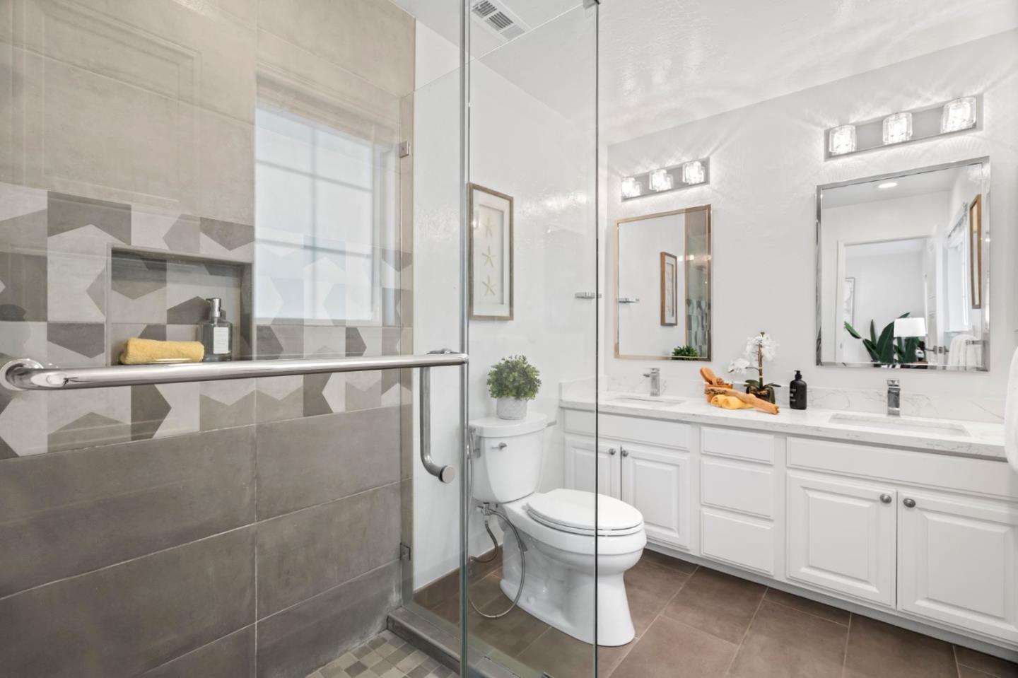 1002 Oaktree Drive San Jose, CA 95129 - Photo 28 of 45 a bathroom with a toilet sink a shower and mirror