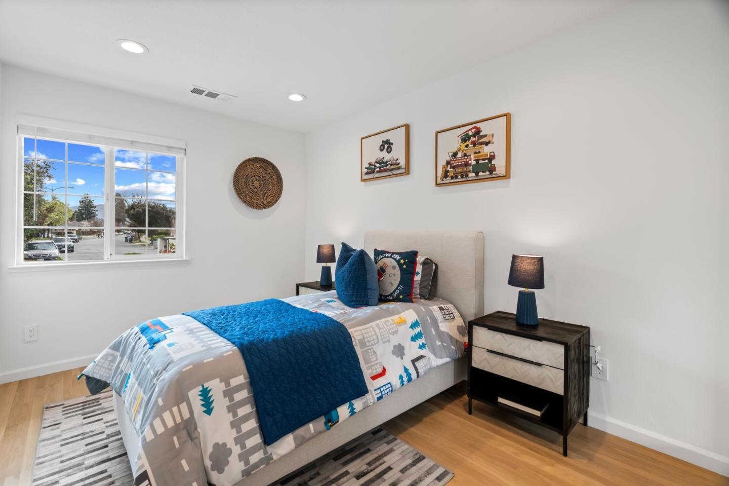 1002 Oaktree Drive San Jose, CA 95129 - Photo 30 of 45 a bedroom with a bed and a window