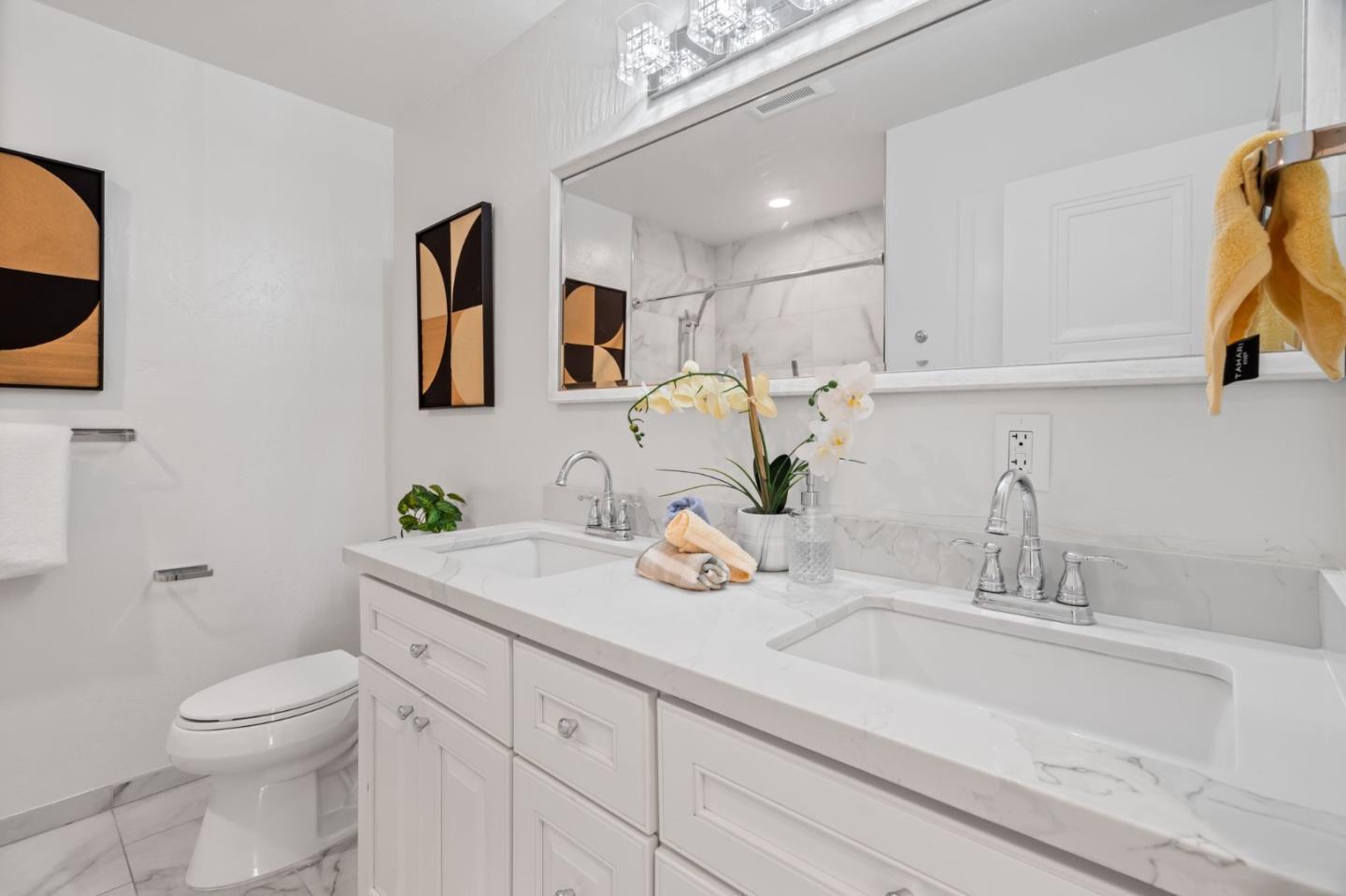 1002 Oaktree Drive San Jose, CA 95129 - Photo 31 of 45 a bathroom with a granite countertop sink a toilet and mirror