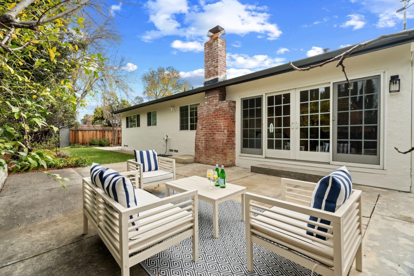 1002 Oaktree Drive San Jose, CA 95129 - Photo 33 of 45 a view of a patio with a table and chairs
