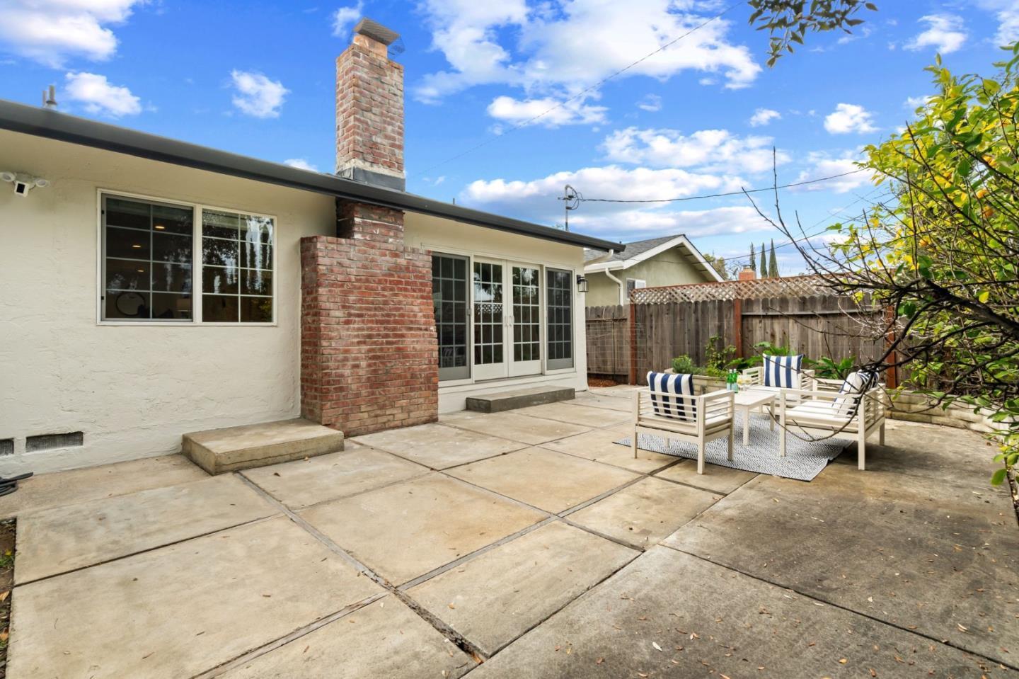 1002 Oaktree Drive San Jose, CA 95129 - Photo 34 of 45 a balcony with furniture and large trees