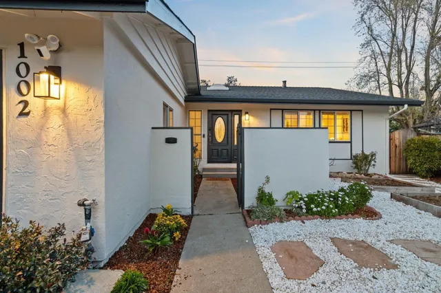 a front view of a house with garden