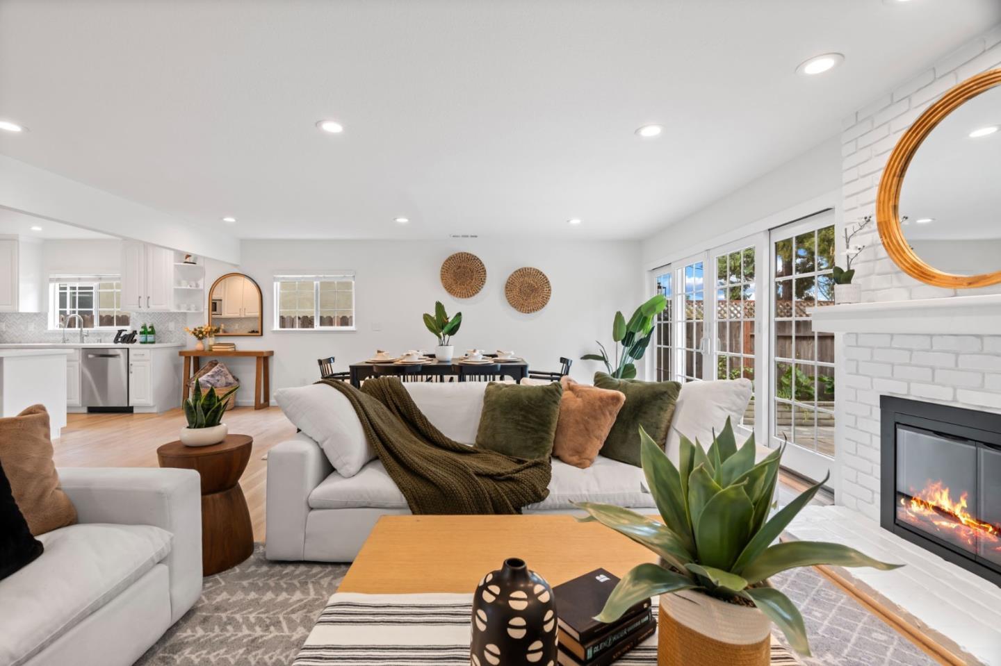 1002 Oaktree Drive San Jose, CA 95129 - Photo 10 of 45 a living room with furniture and a fireplace