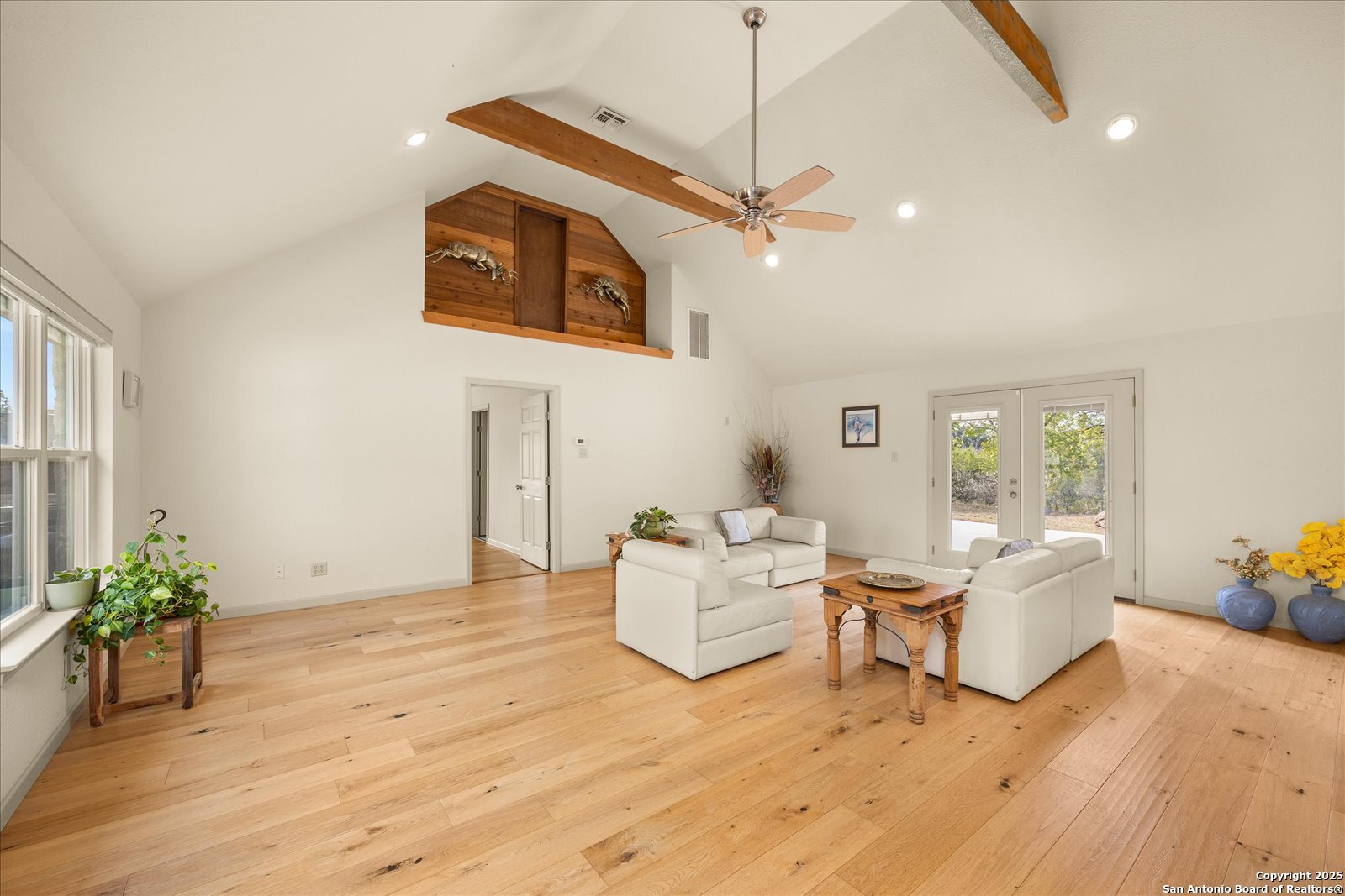 127 Camp Alzafar Road Boerne, TX 78006 - Photo 20 of 50 a living room with fireplace furniture and a wooden floor