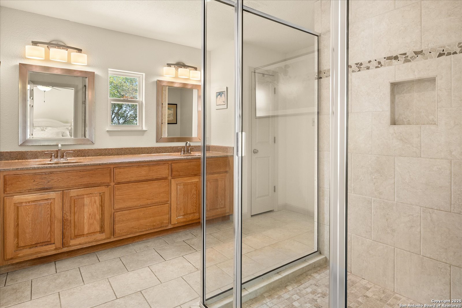 127 Camp Alzafar Road Boerne, TX 78006 - Photo 22 of 50 a bathroom with a shower sink and mirror