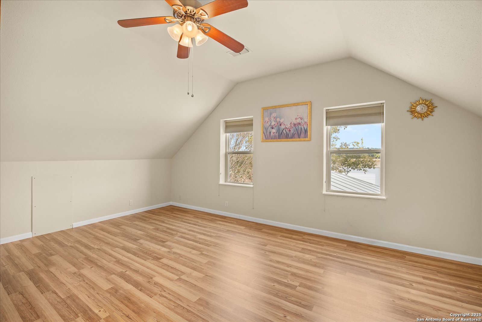 127 Camp Alzafar Road Boerne, TX 78006 - Photo 30 of 50 a view of a big room with wooden floor and windows