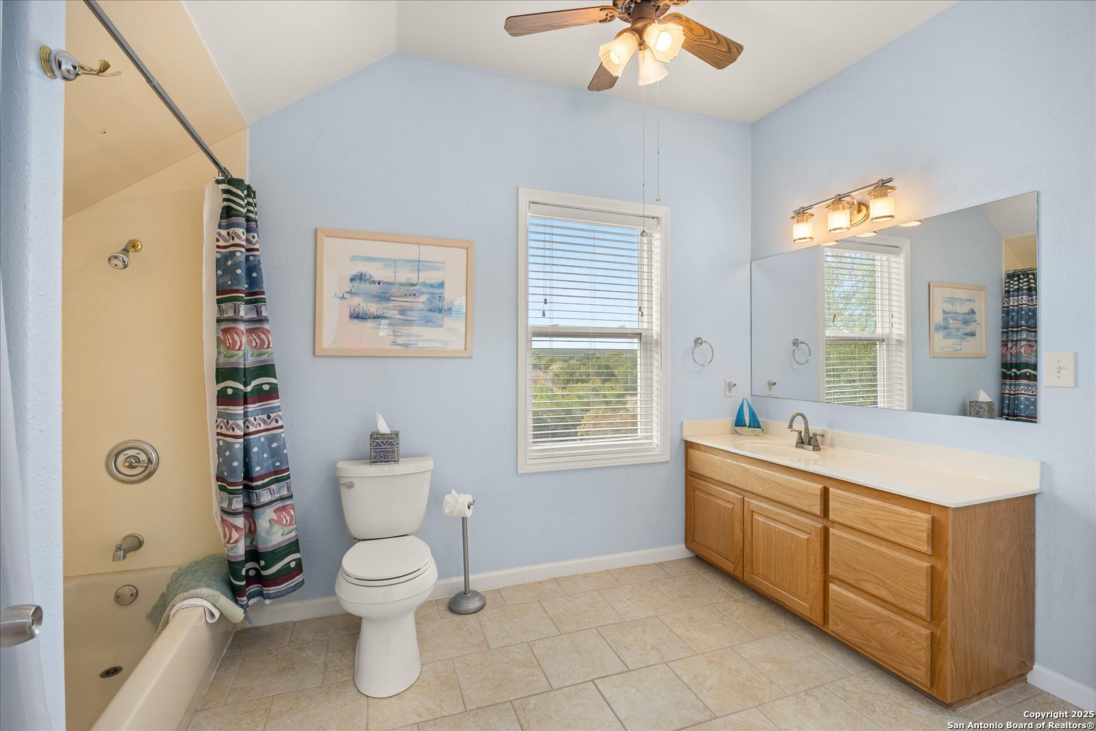 127 Camp Alzafar Road Boerne, TX 78006 - Photo 31 of 50 a bathroom with a double vanity sink toilet mirror and bathtub