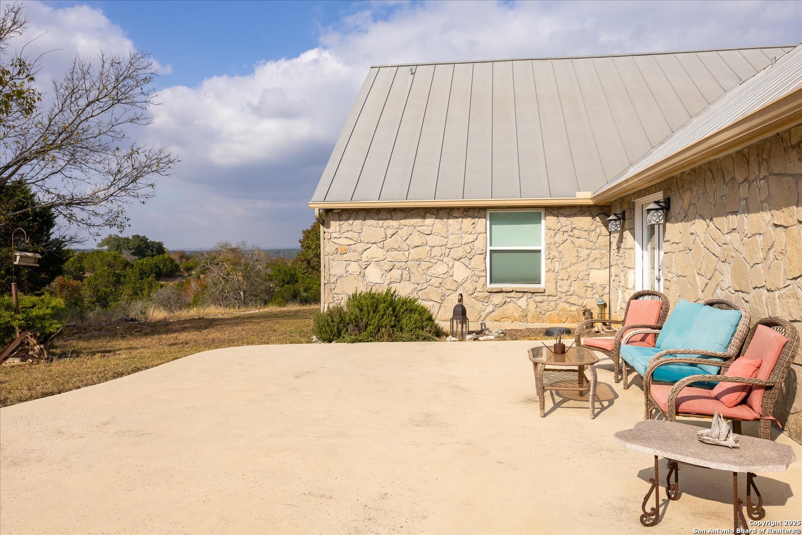 127 Camp Alzafar Road Boerne, TX 78006 - Photo 34 of 50 a view of house with yard and sitting area