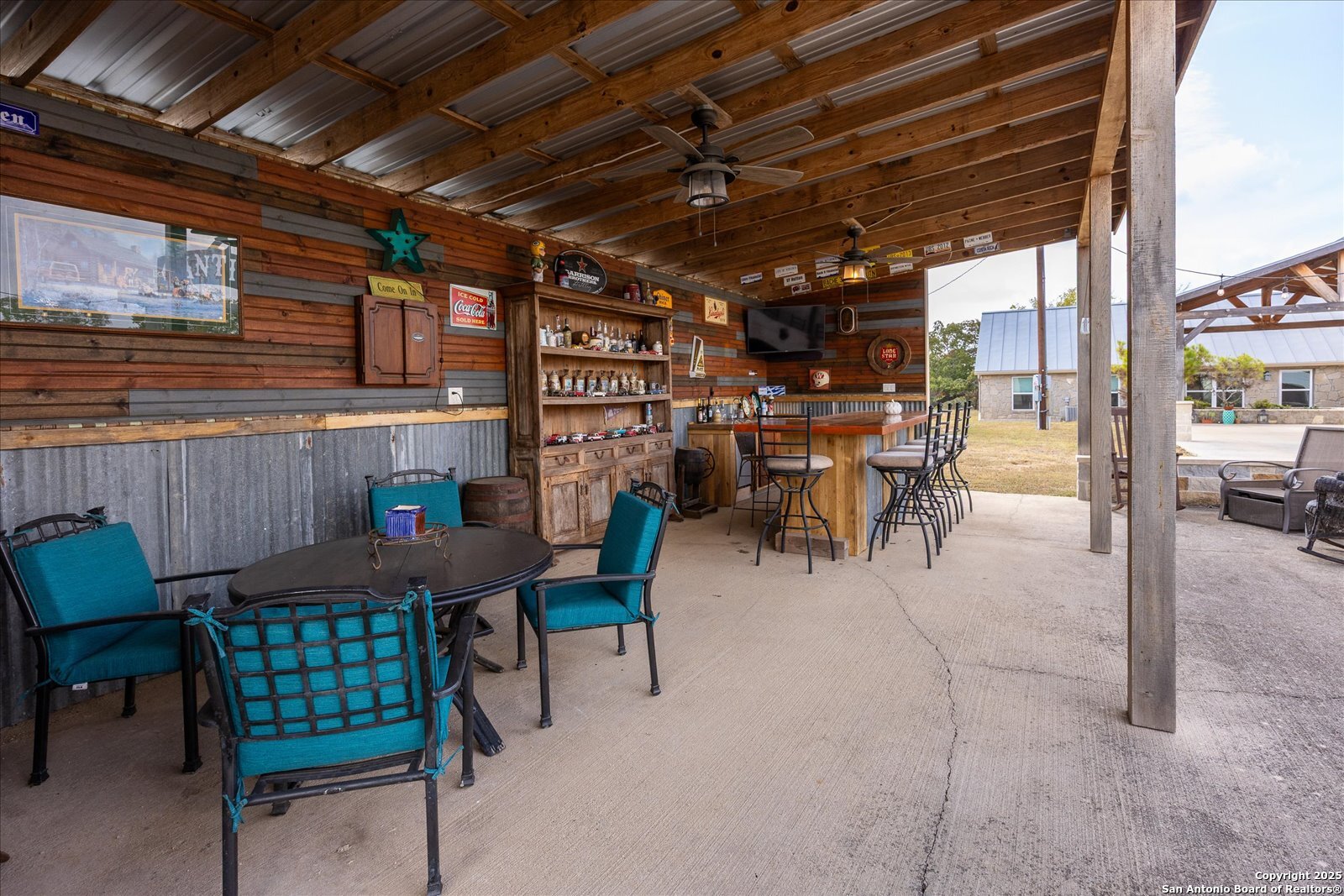 127 Camp Alzafar Road Boerne, TX 78006 - Photo 37 of 50 a view of a patio with table and chairs