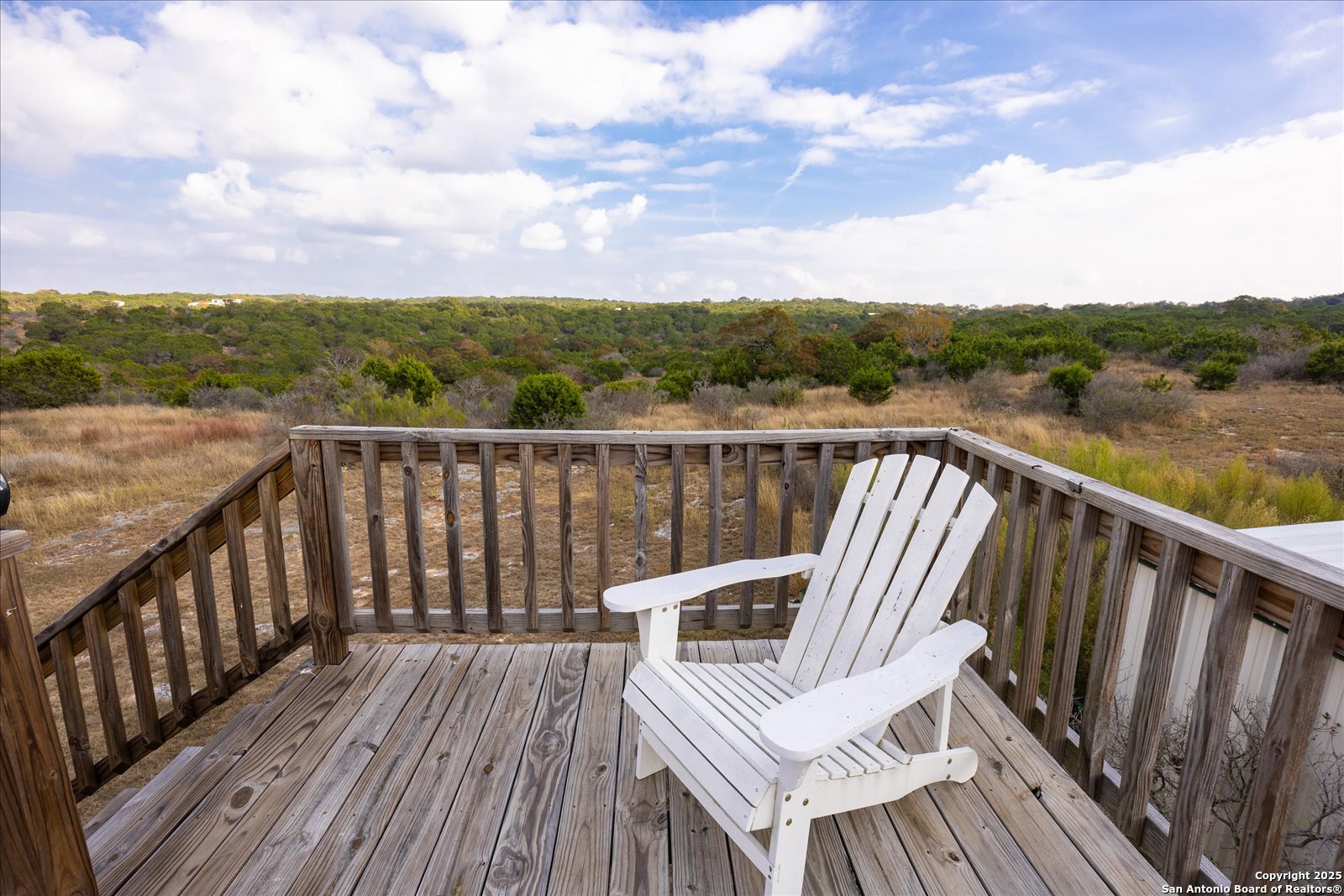 127 Camp Alzafar Road Boerne, TX 78006 - Photo 39 of 50 a view of a roof deck with wooden floor and fence
