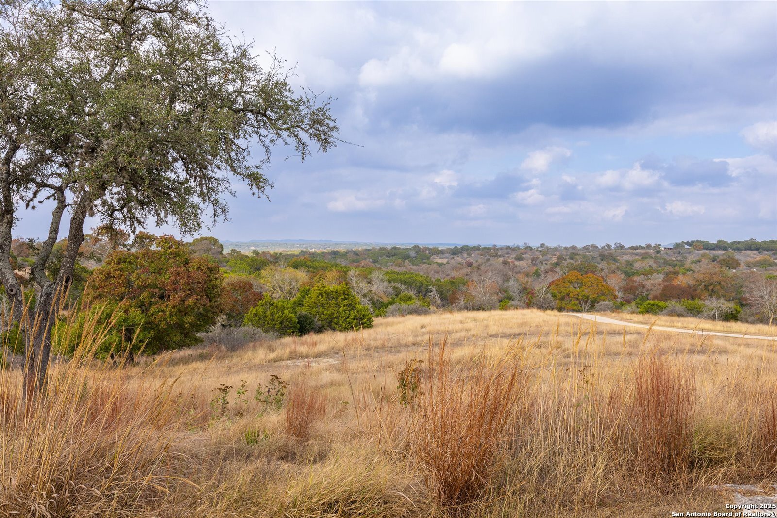 127 Camp Alzafar Road Boerne, TX 78006 - Photo 6 of 50 a view of an lake and a mountain
