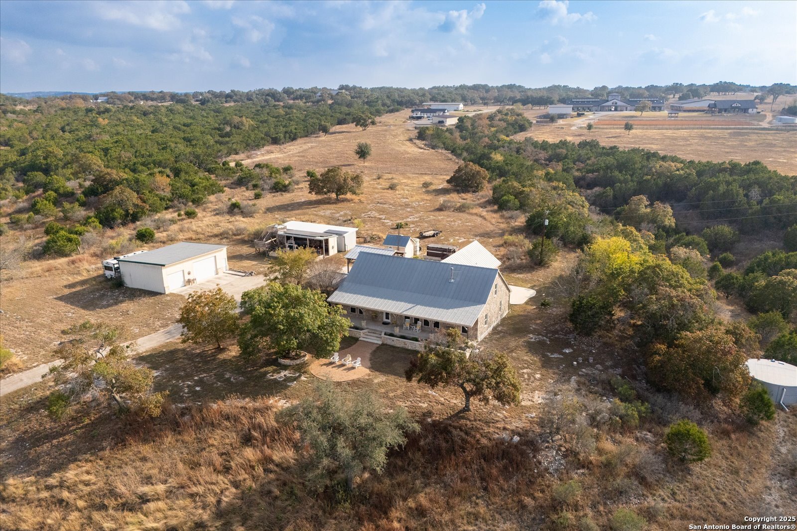 127 Camp Alzafar Road Boerne, TX 78006 - Photo 7 of 50 an aerial view of residential house with outdoor space and river