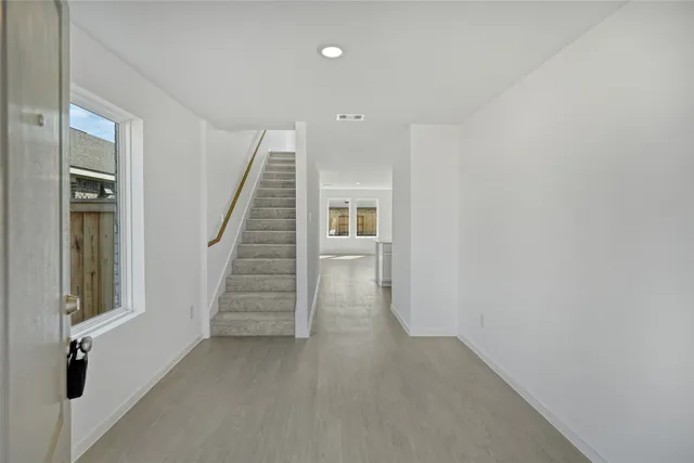 a view of a hallway with staircase