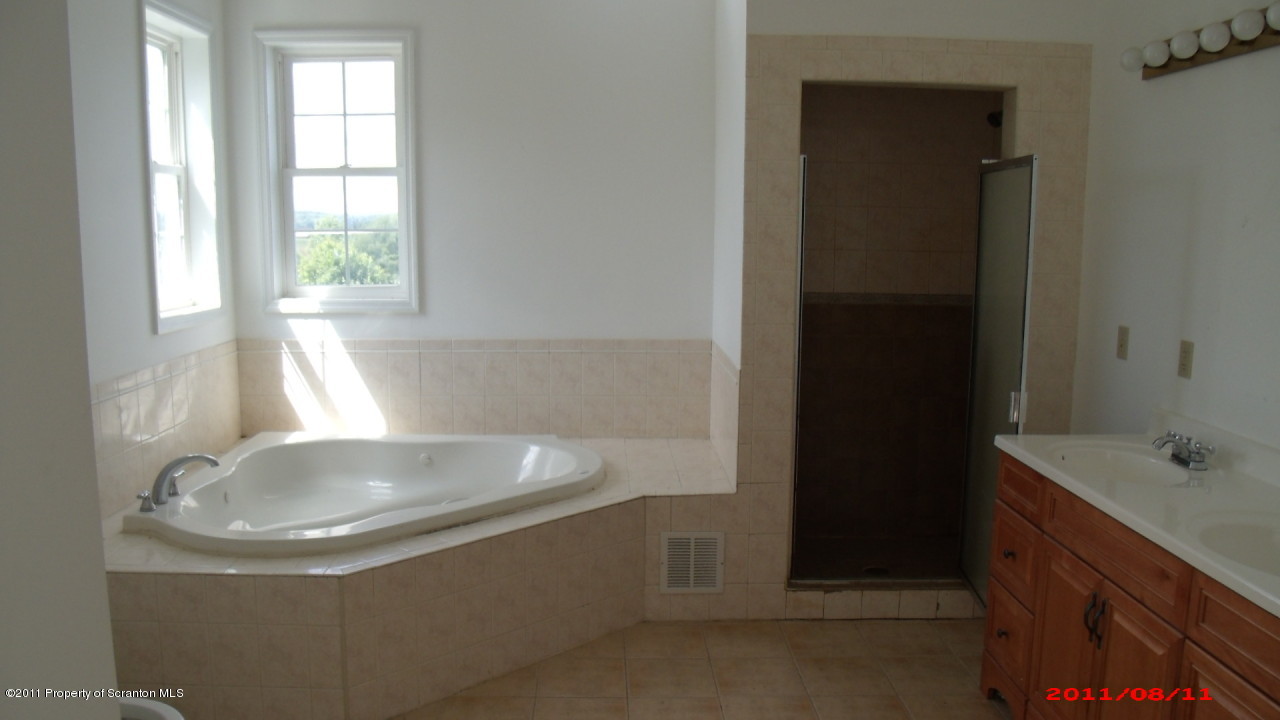 2 Pitcavage Moscow, PA 18444 - Photo 14 of 27 a bathroom with a sink and a bathtub