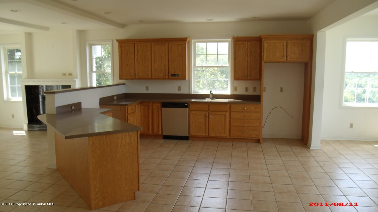 2 Pitcavage Moscow, PA 18444 - Photo 23 of 27 a kitchen with stainless steel appliances granite countertop a sink and a stove
