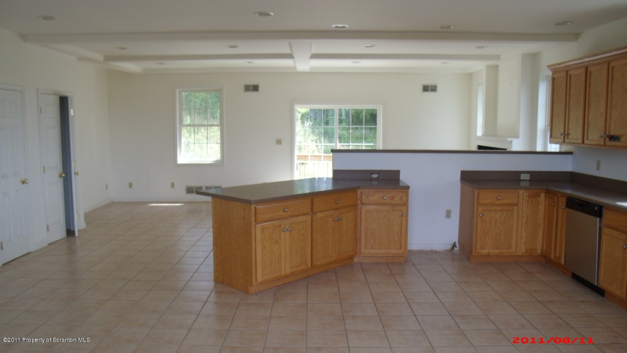 2 Pitcavage Moscow, PA 18444 - Photo 24 of 27 a kitchen with granite countertop white cabinets and window
