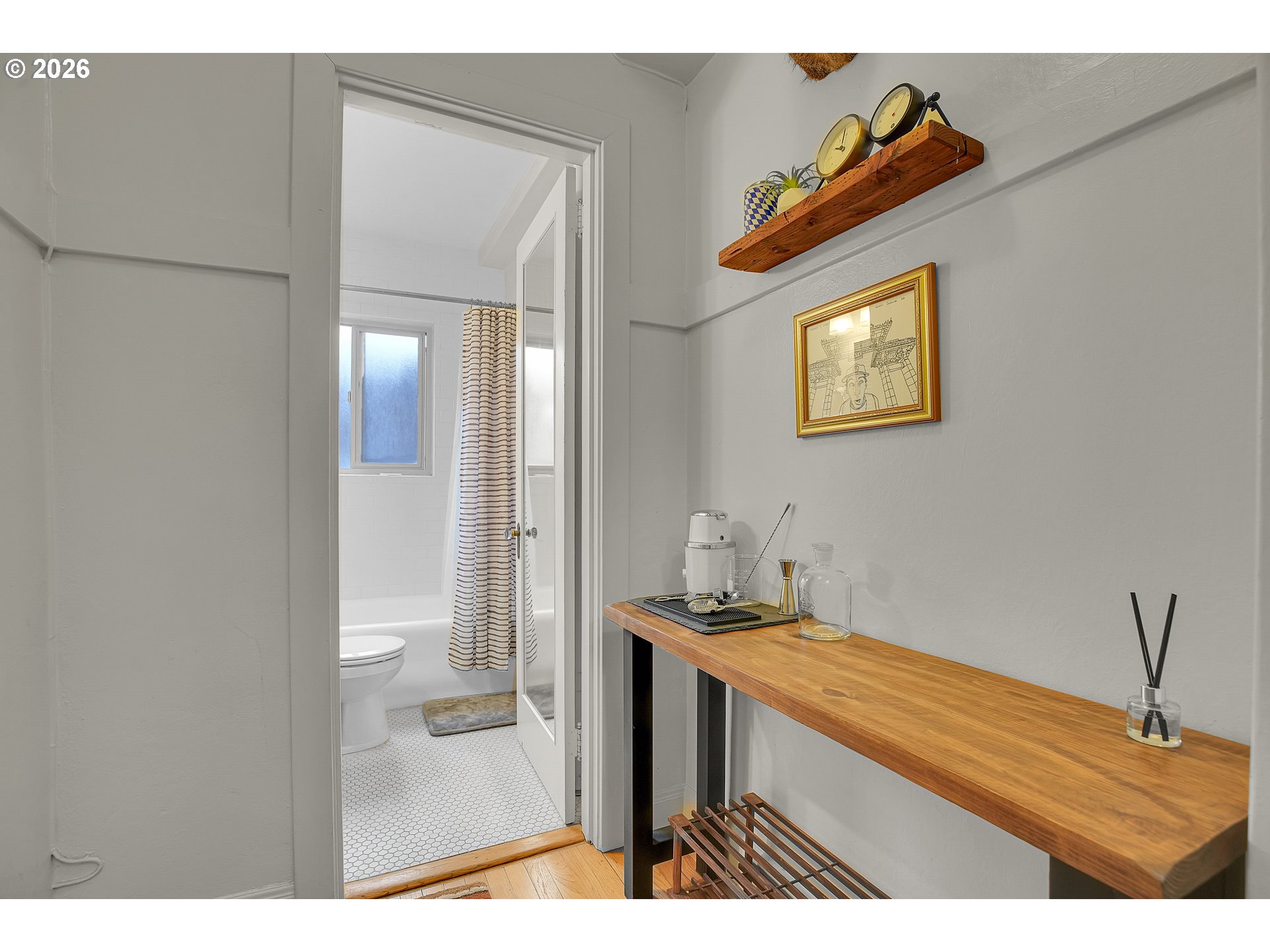 709 Southwest 16th Avenue, Unit 207 Portland, OR 97205 - Photo 11 of 47 a bathroom with a sink a mirror and a shower