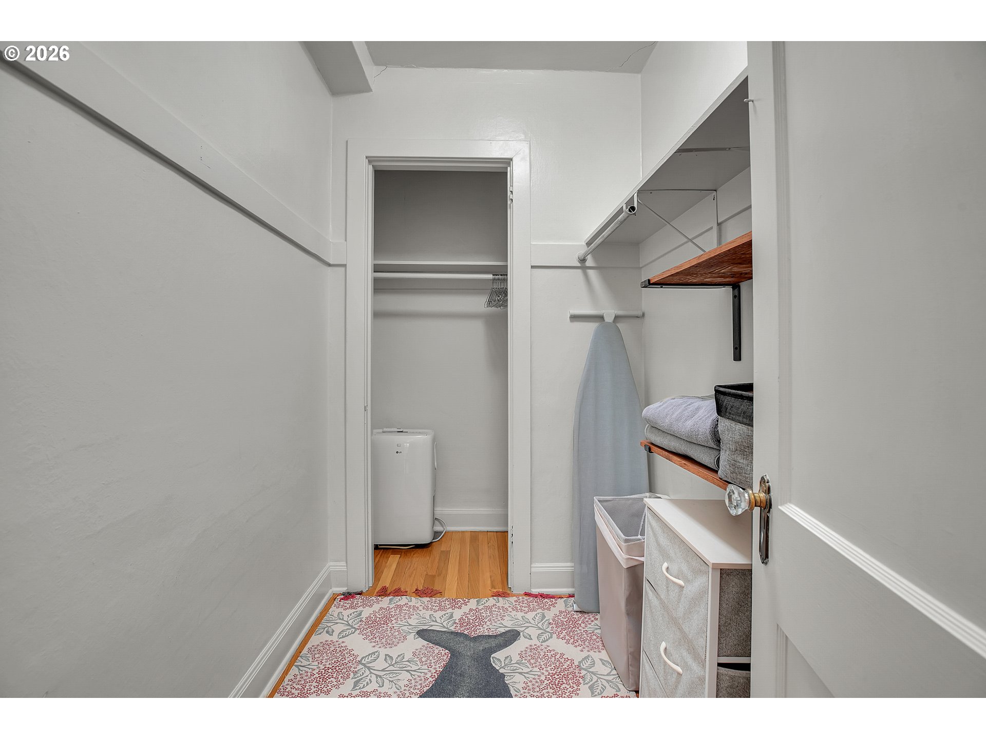 709 Southwest 16th Avenue, Unit 207 Portland, OR 97205 - Photo 15 of 47 a view of hallway with wooden floor and furniture
