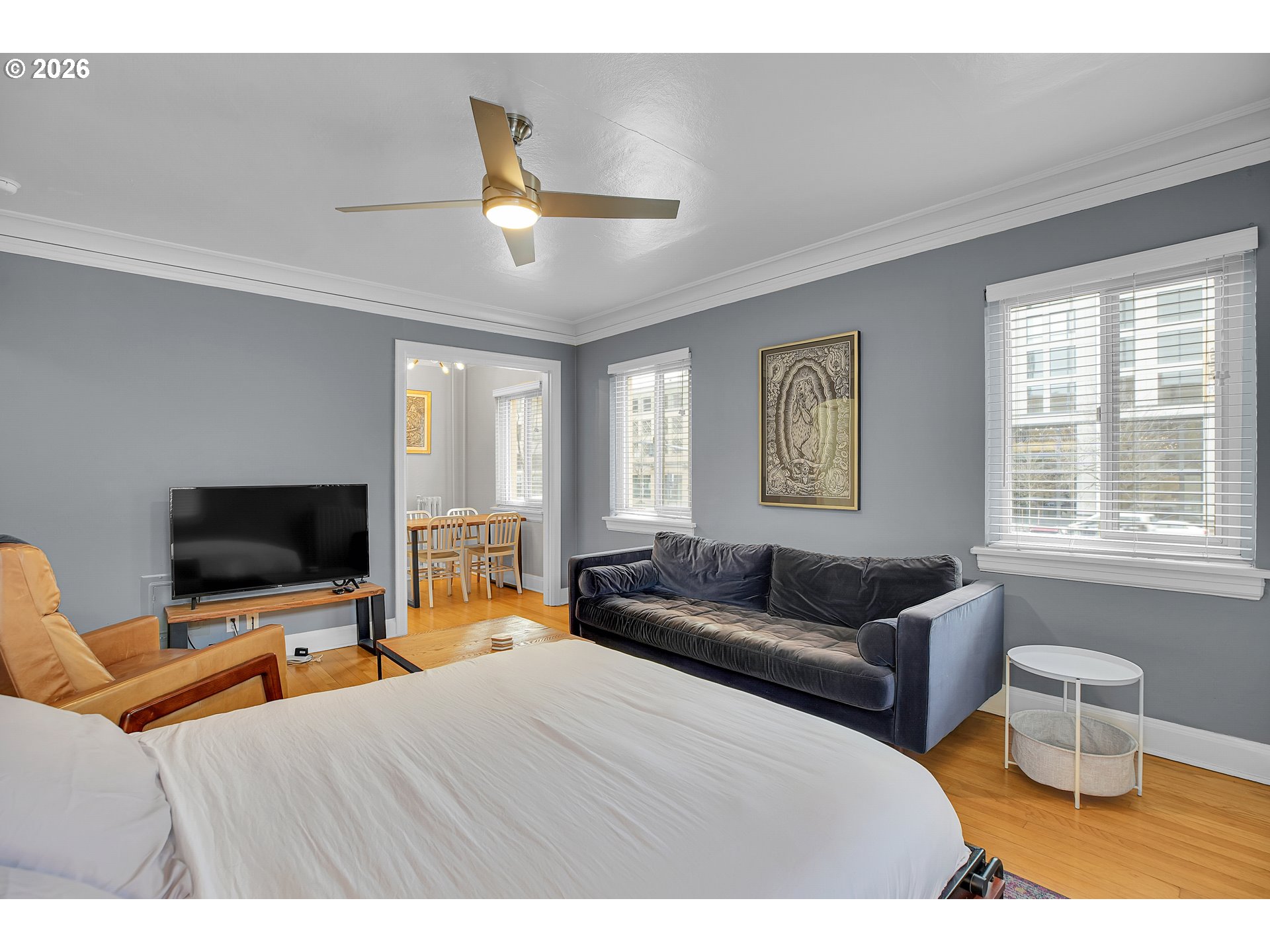 709 Southwest 16th Avenue, Unit 207 Portland, OR 97205 - Photo 20 of 47 a bedroom with furniture and a flat screen tv